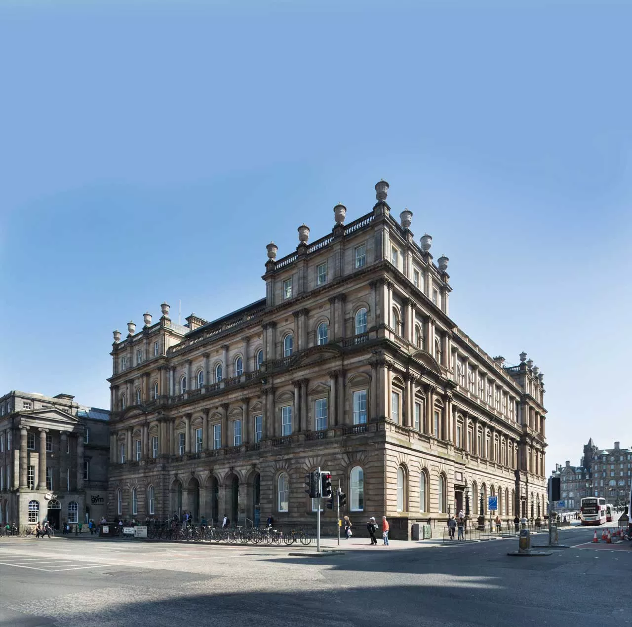 External photo of the building taken from across the street with a blue sky background.